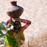 A Smiling woman fetching water, Mithi, Thar, Sindh, December 30, 2012