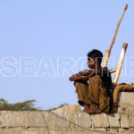 A boy on the wall, Karachi, Sindh, December 27, 2013