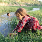 A girl filling the water from a stream, Kohat, KP, September 29, 2015