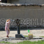 A girl trying to fill her pitcher, Peshawar, KP, September 29, 2011