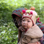 A girl with her sister, Basha Valley, Gilgit-Baltistan, July 23, 2014