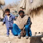 A man with his son, Mithi, Thar, Sindh, December 30, 2012