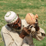 A vendor giving final touches to clay pot, Multan, Punjab, October 20, 2013