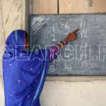 A woman reading from the board, Tando Allah Yar, Sindh, December 29, 2016