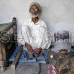 An old Cobbler, Nowshehra, KP, April 22, 2008