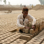 A man with a pile of Bricks, Lahore, Punjab, November 3, 2014