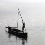 Child steering the boat, Manchar Lake, Dadu, Sindh, December 31, 2016